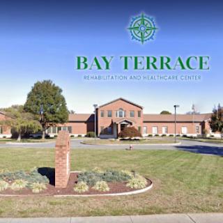 Welcome to Bay Terrace, a beautiful facility surrounded by lush landscaping.