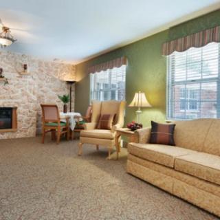 A cozy living room with comfortable seating and elegant decor.
