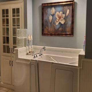 A beautifully designed bathroom sink area featuring elegant artwork and sophisticated decor.