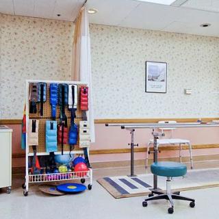 A therapy room equipped with exercise and rehabilitation tools.