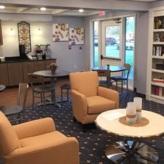 A cozy lobby with comfortable seating and a coffee station.