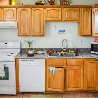A well-equipped kitchen with wooden cabinets and modern appliances.