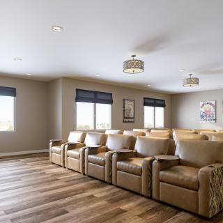 A modern home theater room with comfortable, luxury seating.