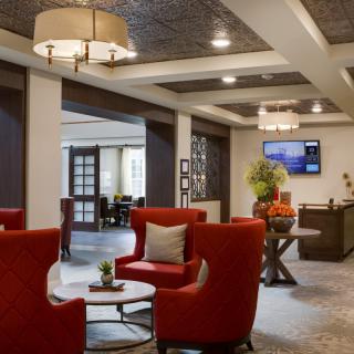 A welcoming hotel lobby with modern decor and comfortable seating.