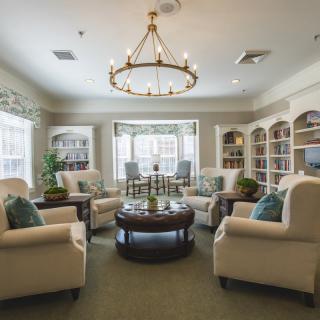 A cozy living room with comfortable seating and elegant decor.
