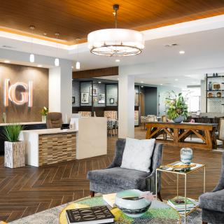 A modern and stylish lobby area featuring comfortable seating, elegant lighting, and contemporary decor.
