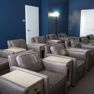 A modern lounge area with rows of comfortable seating.