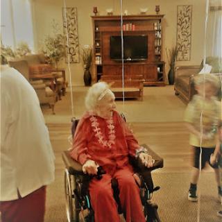 A joyful moment shared between family members in a cozy living room setting.