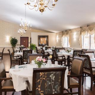 An elegantly designed dining room featuring well-set tables and tasteful decor.