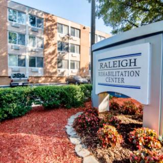 Exterior view of the Raleigh Rehabilitation Center with well-maintained landscaping.