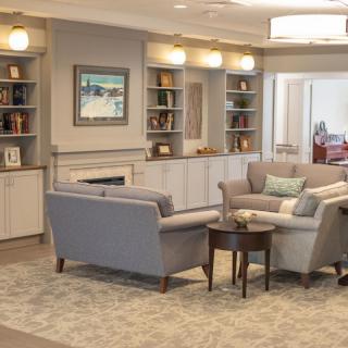 A cozy living room with comfortable seating and built-in shelves.