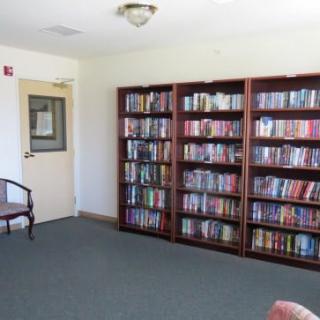 A quiet library space with shelves full of books.