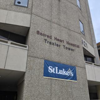 St. Luke's Sacred Heart Hospital Tower, showcasing the entrance and signage of the medical facility.