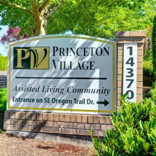 Sign for Princeton Village Assisted Living Community at entrance.