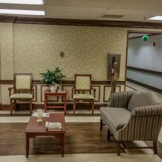 A cozy waiting area featuring comfortable seating and decorative elements.