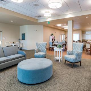 A modern living room with comfortable seating and stylish decor.