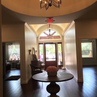A beautiful and welcoming foyer showcasing elegant decor and natural light.