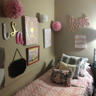 A cozy and colorful bedroom filled with fun wall art and decorative elements.