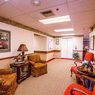A cozy lobby area with comfortable seating and warm lighting.