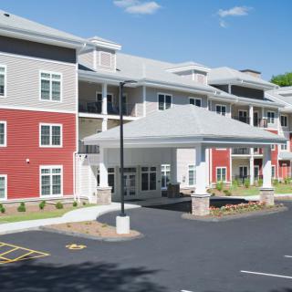 A modern residential apartment building with a welcoming entrance.