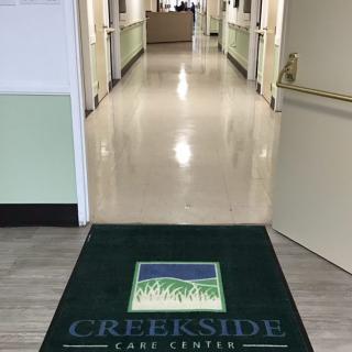 Entrance to Creekside Care Center with a hallway in view.