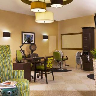 A modern salon interior with stylish decor and comfortable seating.