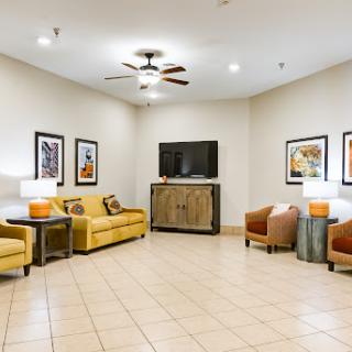 A cozy lobby area featuring comfortable seating and modern decor.
