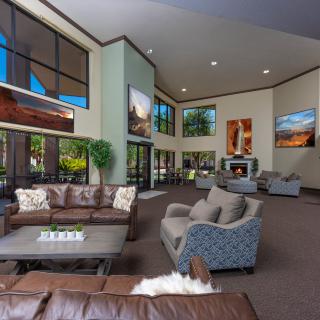 A spacious and modern lobby with comfortable seating areas and large windows.