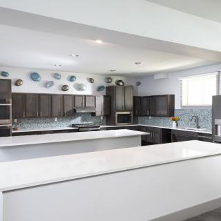 A modern kitchen with sleek countertops and contemporary decor.