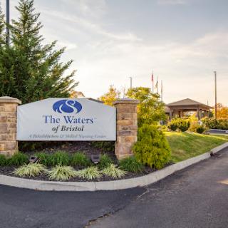 Entrance sign of The Waves of Vornado, featuring well-maintained landscaping.