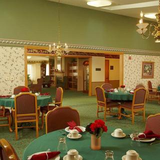 A well-decorated dining room with tables set for a meal.
