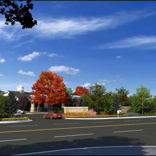 A scenic autumn road with vibrant trees and a clear sky.