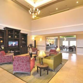 A cozy lobby featuring comfortable seating, warm lighting, and a welcoming atmosphere.