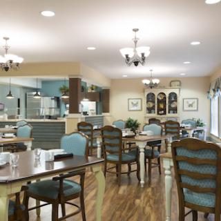 A cozy dining area featuring elegant furniture and a warm atmosphere.