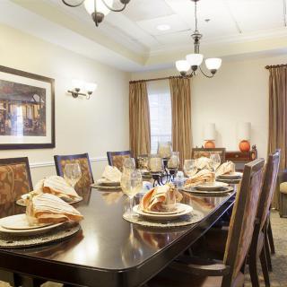 A beautifully set dining table in an elegant dining room.