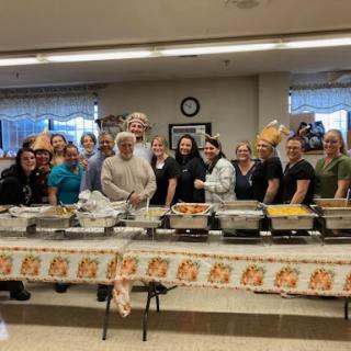 Volunteers gathered to serve meals at a community event.