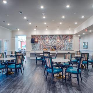 A modern dining area with stylish seating and sophisticated lighting.