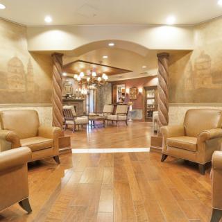 A cozy lobby area with comfortable seating and elegant lighting.