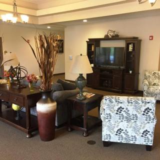 Cozy living room with elegant furniture and decorative elements.