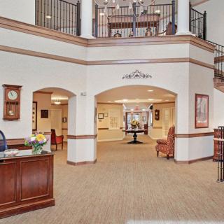 Spacious lobby area with reception desk and seating.
