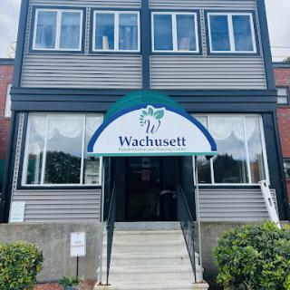 The entrance of the Wachusett building, showcasing modern architecture and clear signage.