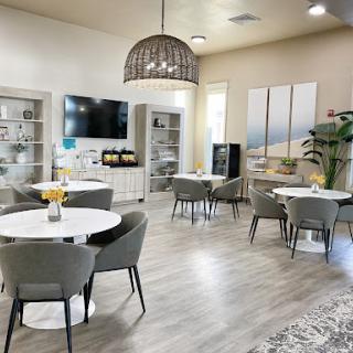 A stylish and modern lounge area featuring light-colored furniture and a welcoming atmosphere.