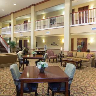 Spacious hotel lobby with comfortable seating and elegant decor.