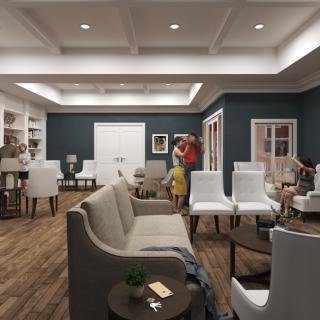 A spacious living room with modern furnishings and a coffered ceiling.