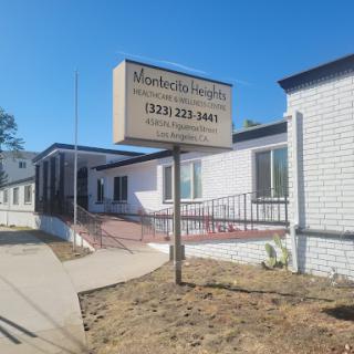 A healthcare facility with a clear sign displaying contact information.