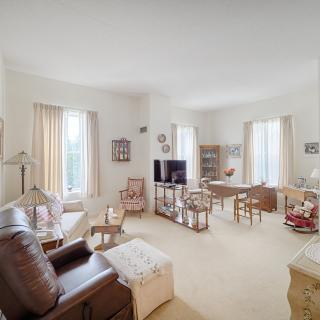 A cozy living room with elegant furniture and decor.