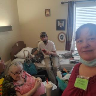 A group of individuals in a cozy room, sharing a moment together.