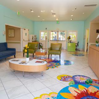 A vibrant and inviting lobby featuring modern furniture and colorful decorations.