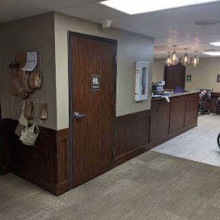 A welcoming lobby area with wooden accents and a reception desk.