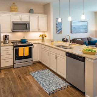 A stylish modern kitchen featuring sleek appliances and a warm, inviting atmosphere.